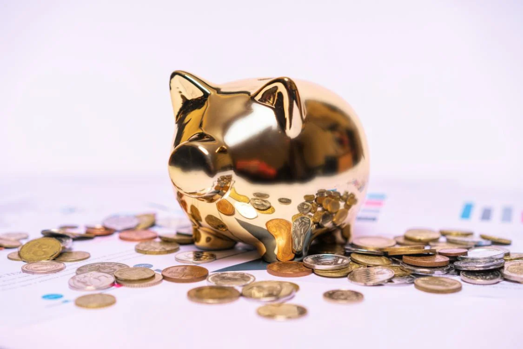 gold and silver coins around a piggy bank - featured image